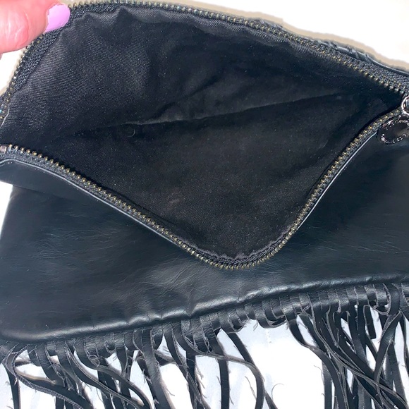 BCBGeneration black clutch bag. Snaps closed hanging leather strings. 2 zippers - Picture 6 of 9